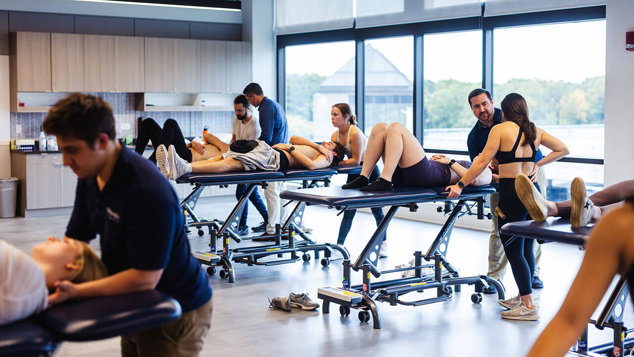 Physical therapy students practice therapeutic rehabilitation procedures on each other in the new labs on the North Haven Campus.