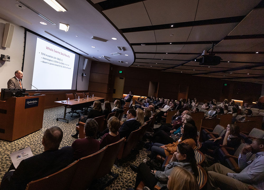 Dr. Alan Sweetser of Massachusetts General Hospital speaks to a packed lecture hall about rare diseases