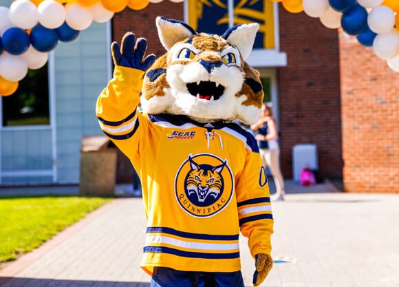 Boomer the mascot waves as he welcome people to campus