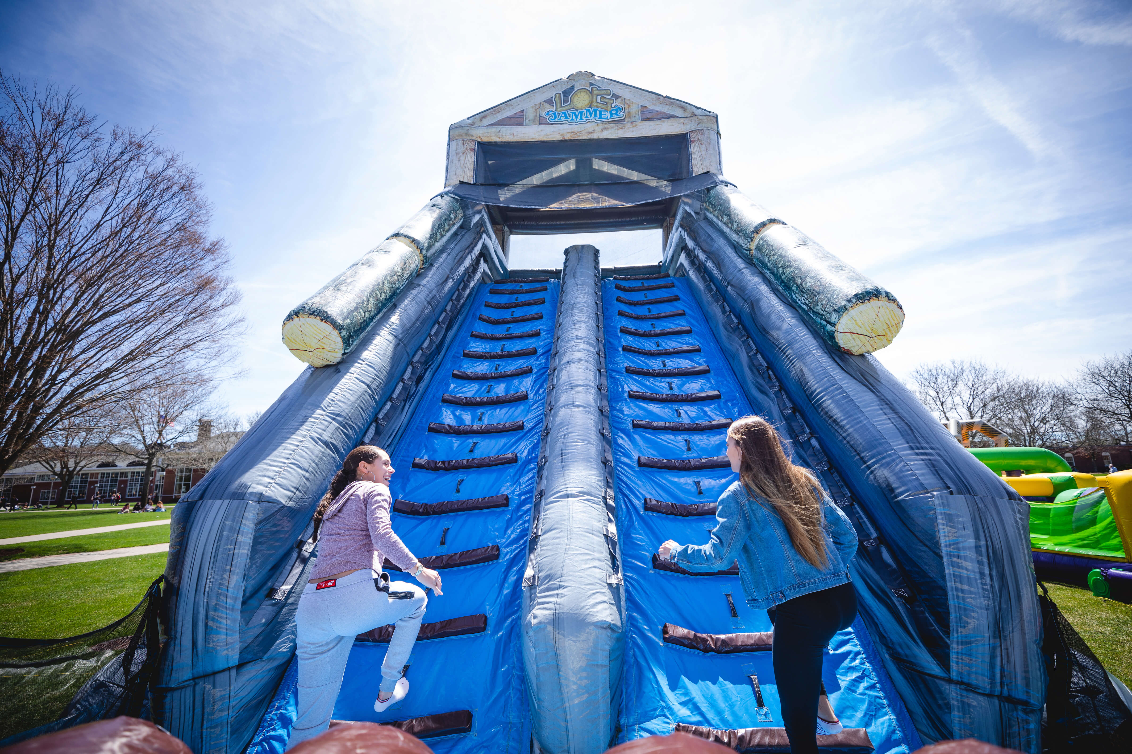 Students race up inflatable course