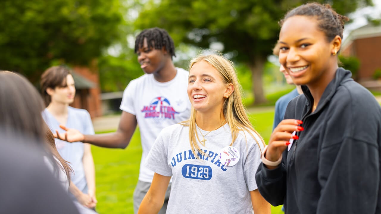 Individuals talking on the Quad during Orientation