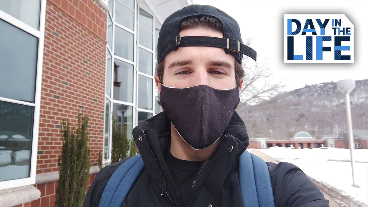Student Joe Iorizzo wearing a mask on campus.