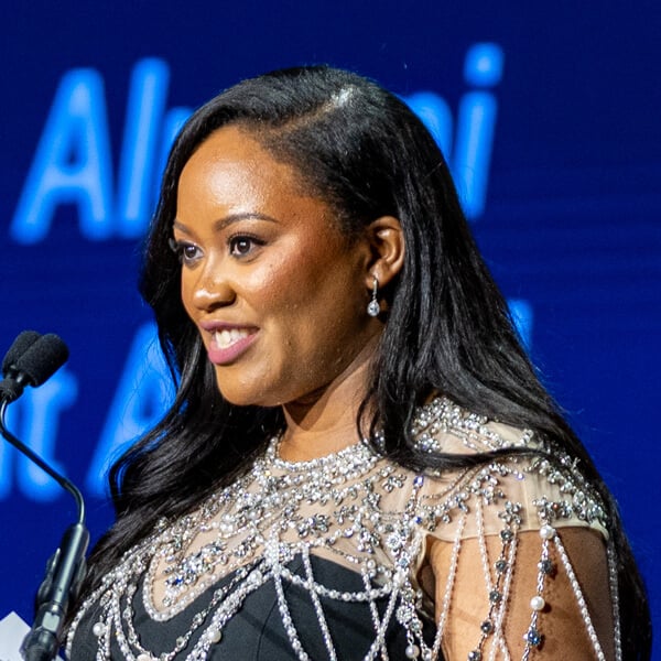 Headshot of Laeticia Iboki speaking at a microphone.