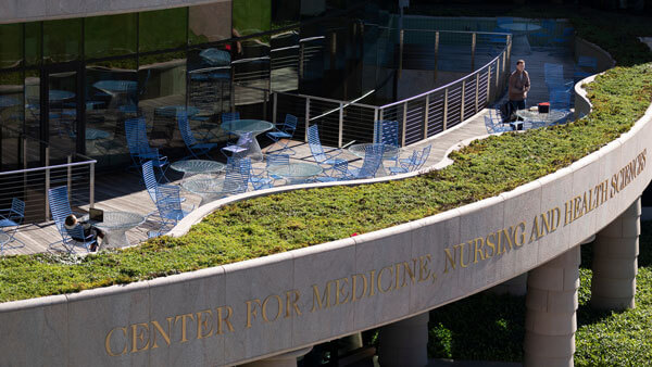 Students sitting on top of the Center of Medicine and Nursing