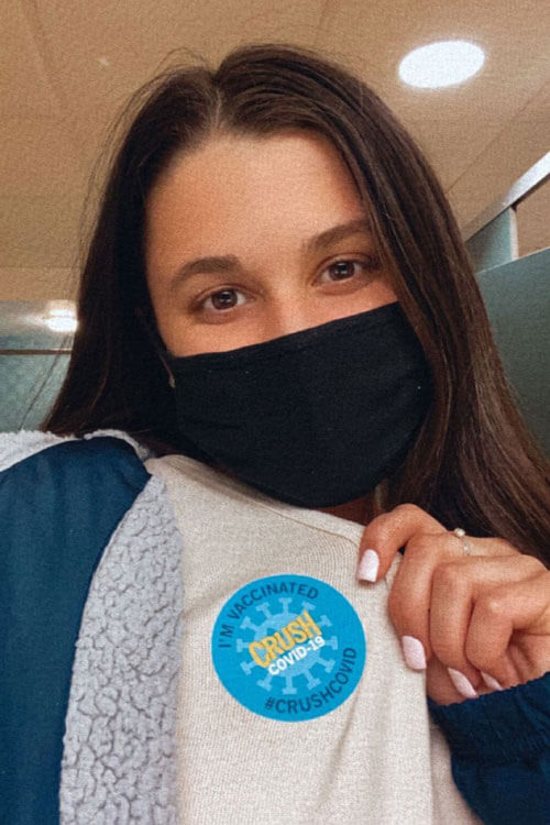 Nicolakis Ephemia shows off her "I got my COVID vaccine" sticker