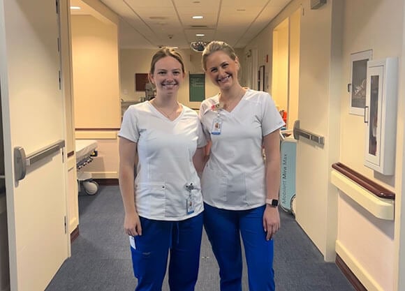 Isabella Ulrich ’24, and Claire Clifford ’24, working in a hospital setting