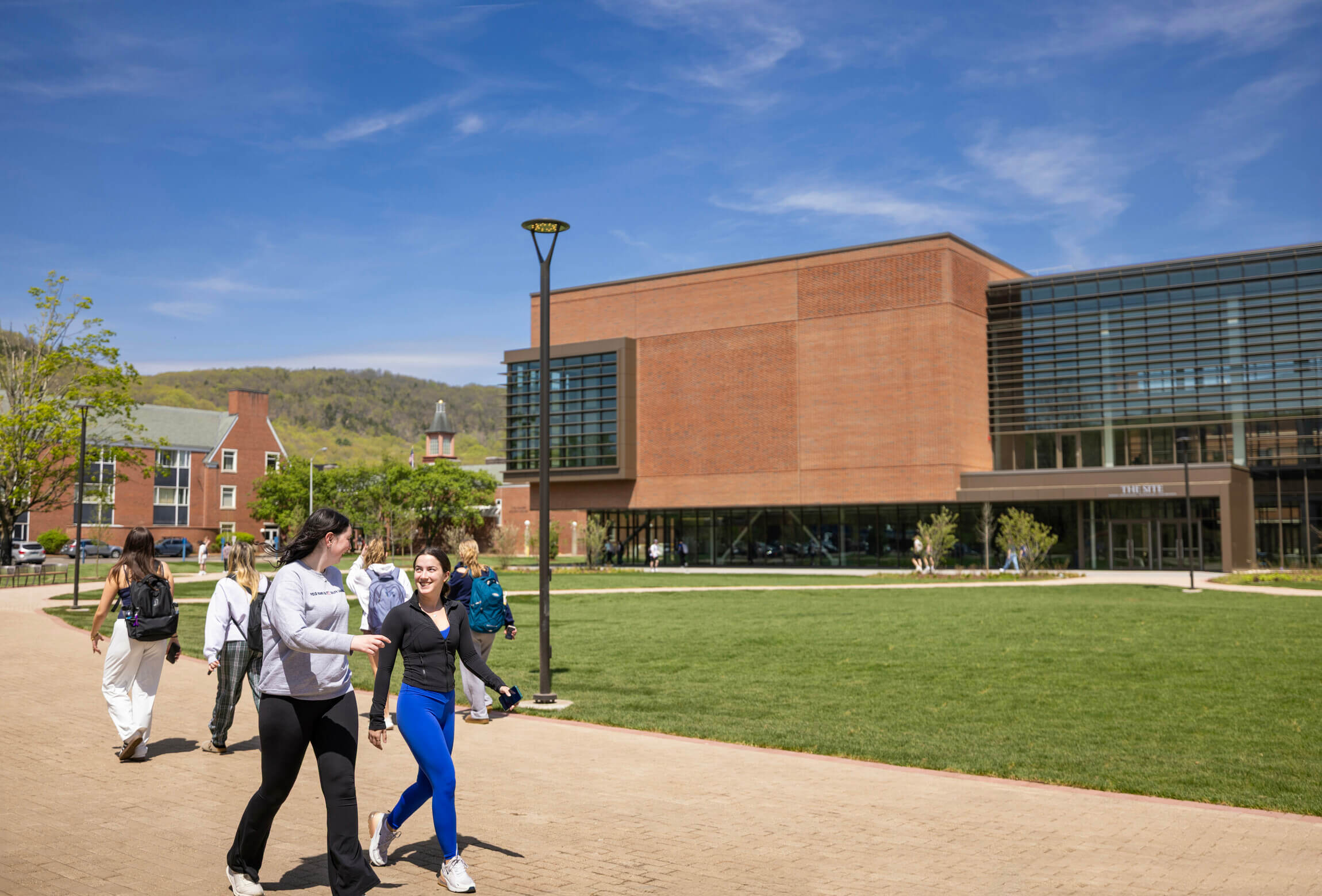 Friends talking and talking through the new South Quad