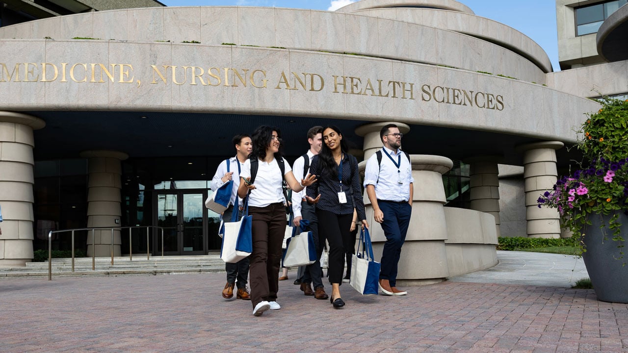 Students walking out of the Frank H. Netter School of Medicine building