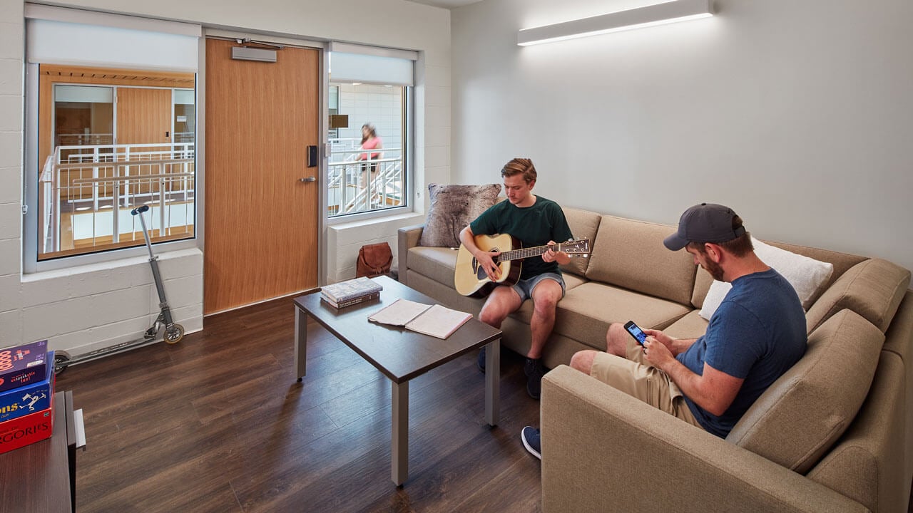 Students sit together in their renovated common area of their dorm