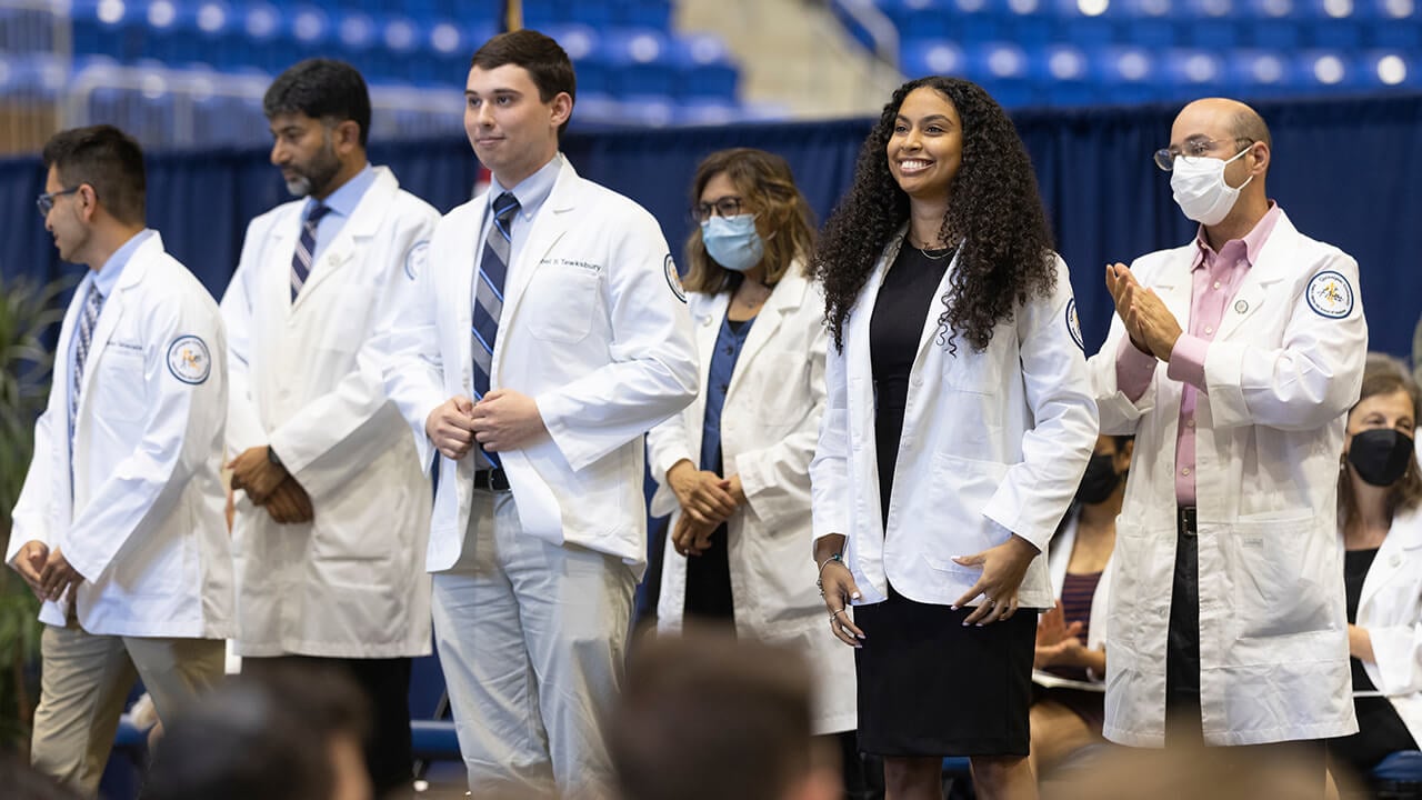 Medical students receive their white coats.