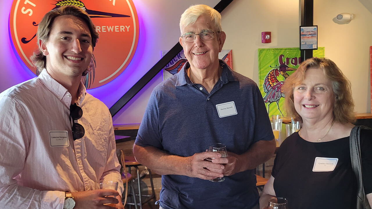 Three alumni members enjoy themselves at Stony Creek Brewery