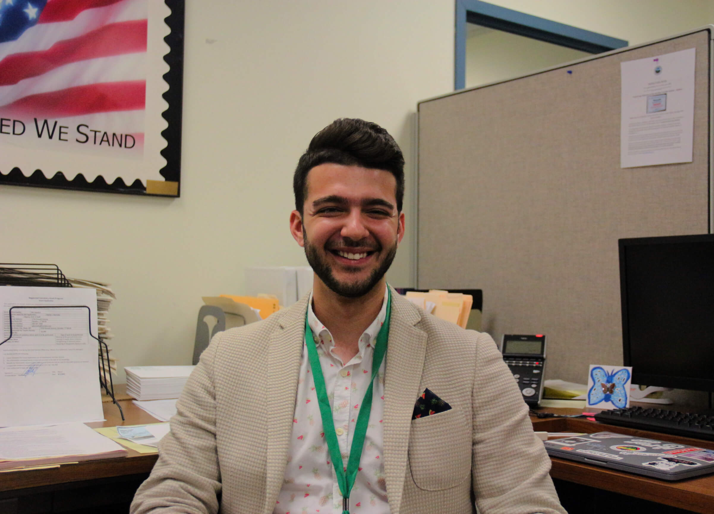 Presidential Public Service Fellow sitting at his desk in the Hamden mayor's office