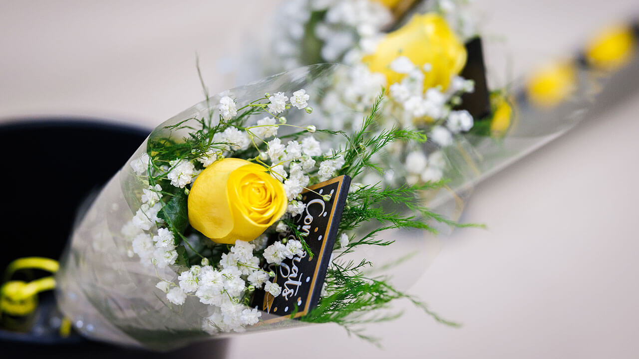 A bouquet of flowers as a congratulatory gift to the graduates
