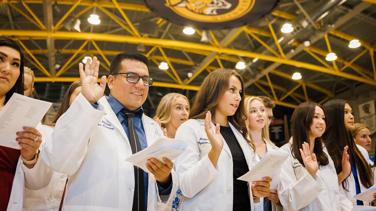Graduates take the Physician Assistant oath