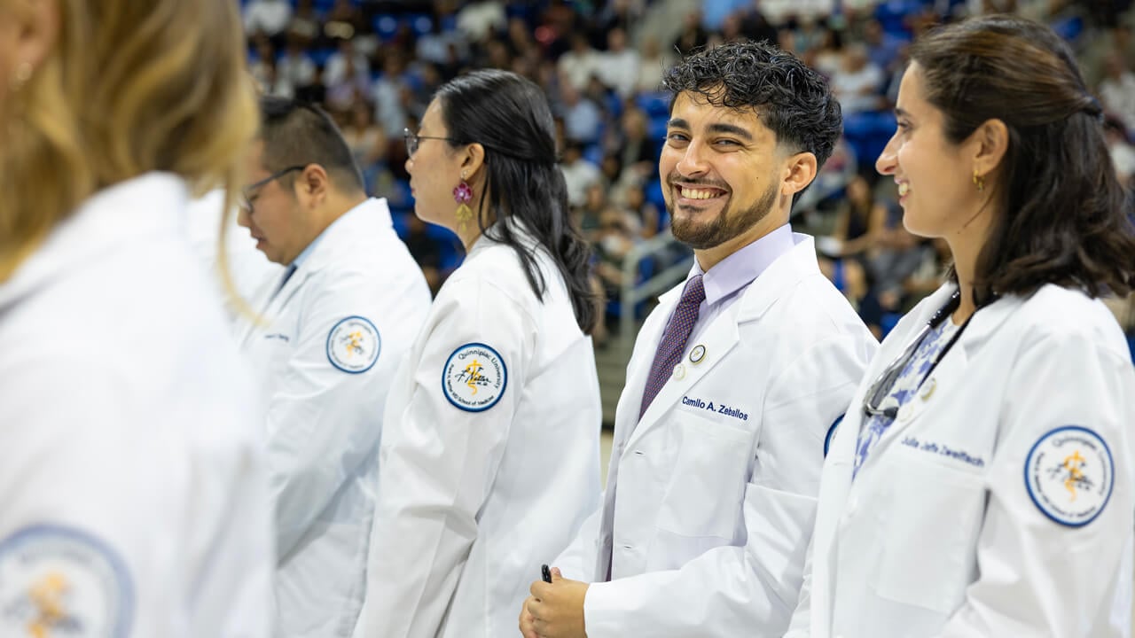 Person smiles at the camera