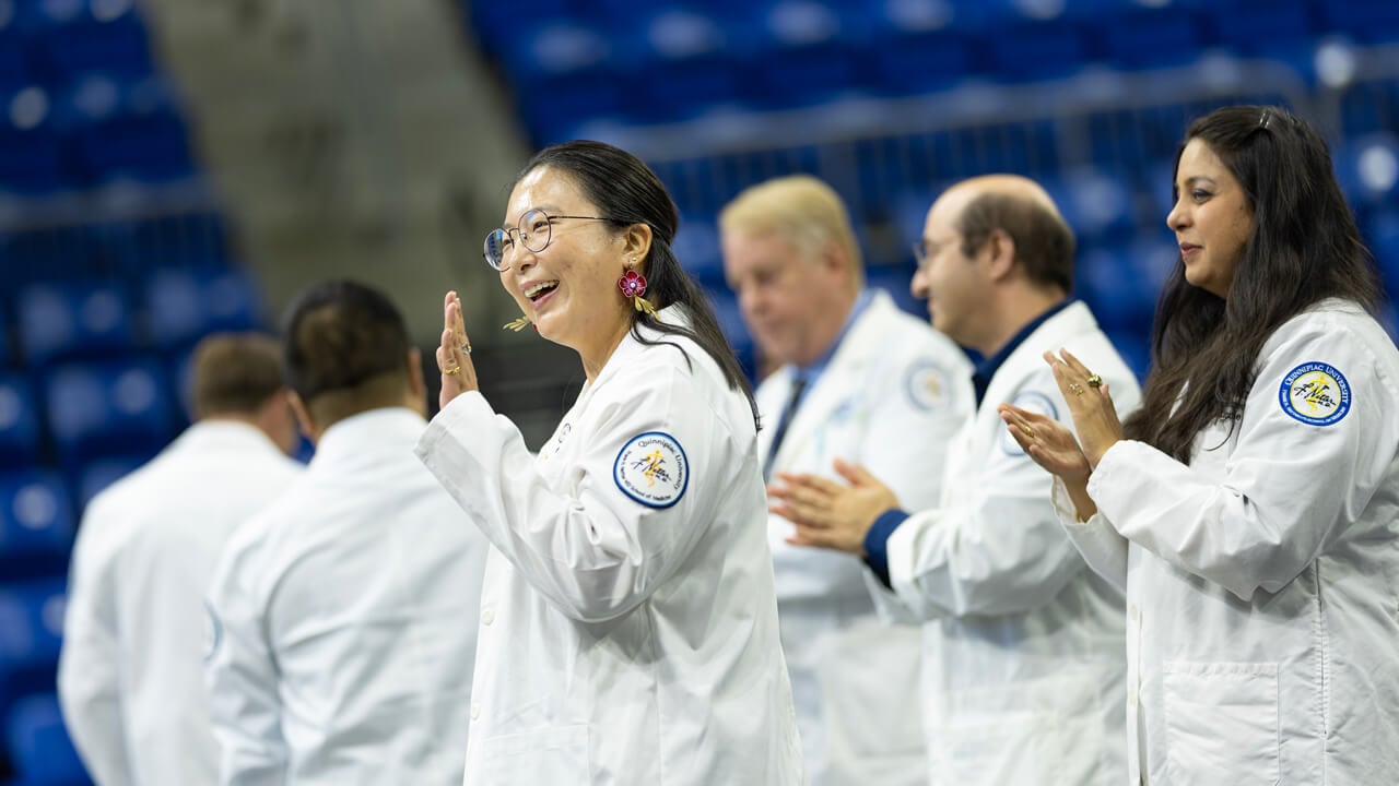 Person waves to the crowd