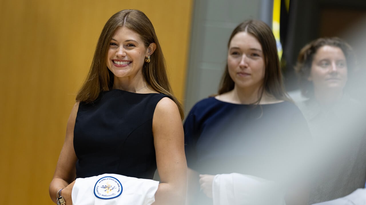 Person waves to camera