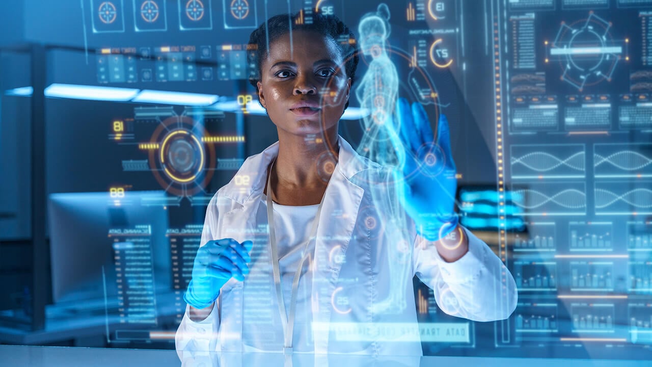 Girl in lab coat with gloves on typing on a futuristic hologram of the human body
