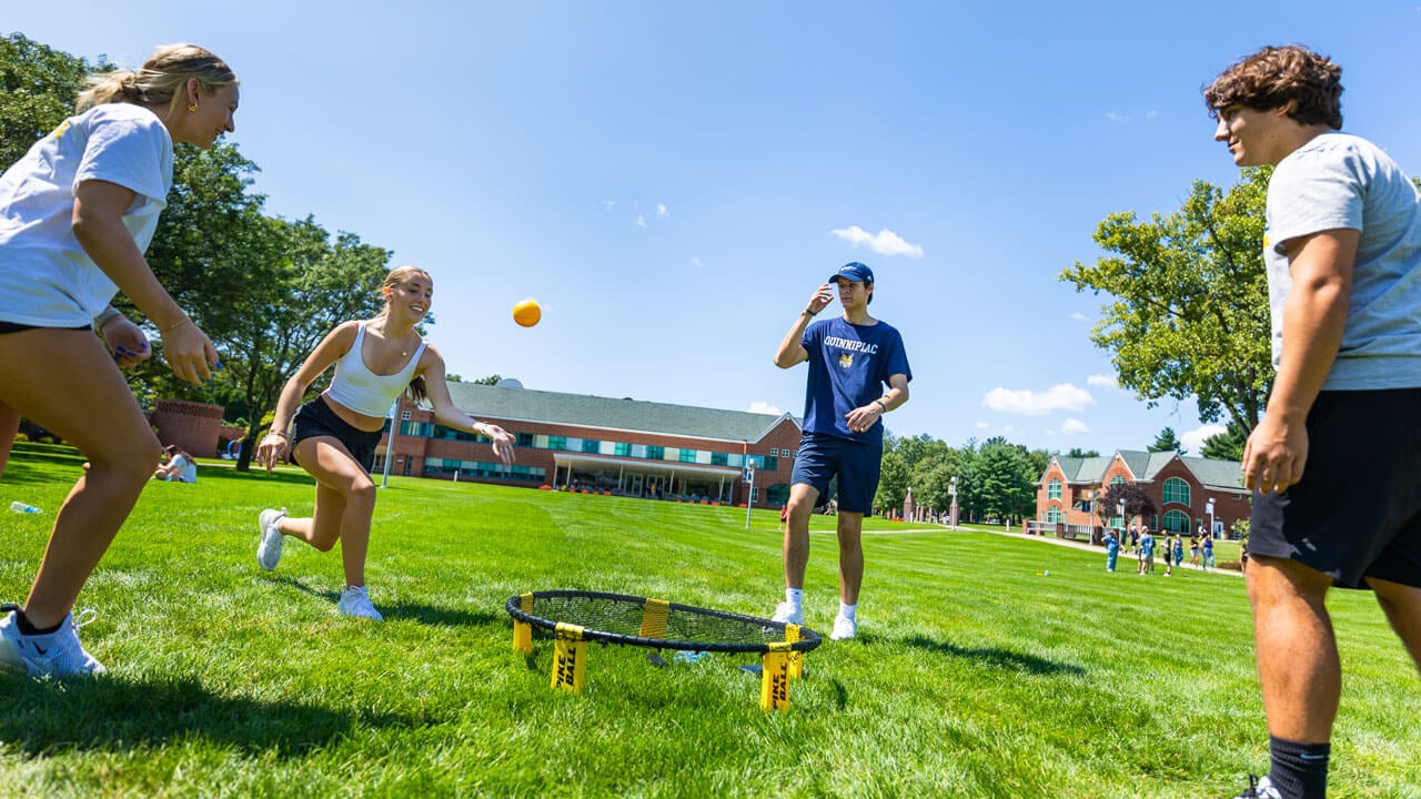 Students playing spike ball on the quad
