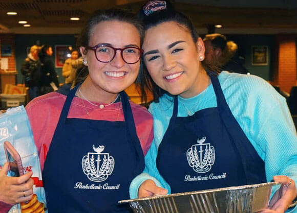 members of the Panhellenic council volunteer at an event