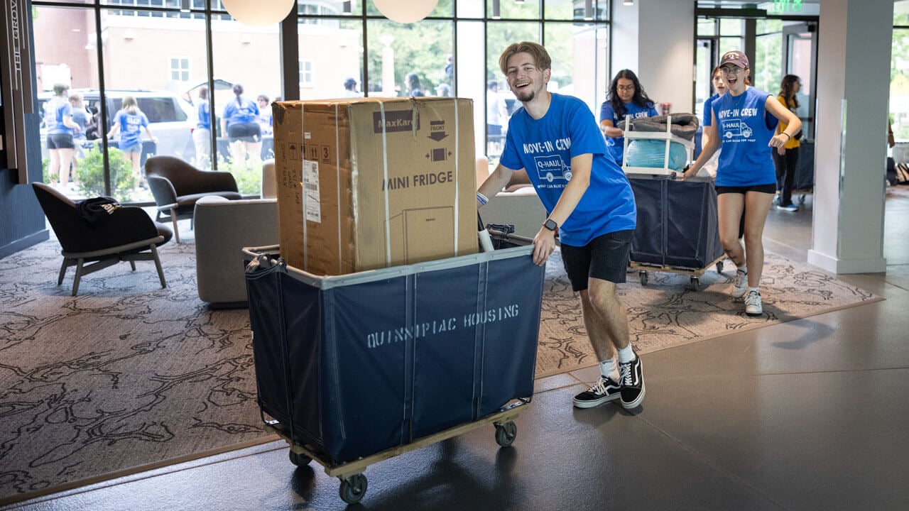 Students help transfer items into The Grove.
