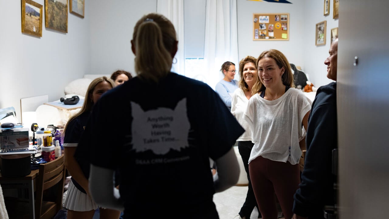 President Marie Hardin greets first year students in their dorms.