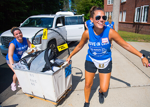 Students help their first-year peers move in.