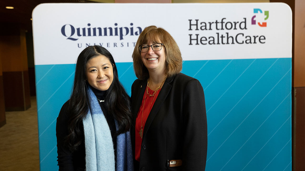 Gillian Chung poses with Dean Lisa O'Connor during the Hartford HealthCare press conference at Quinnipiac