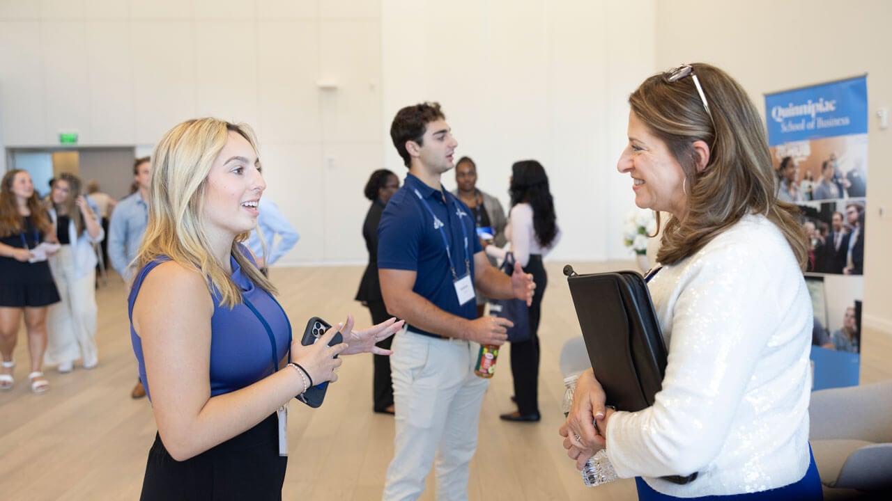 Dean Holly Raider talks to a student