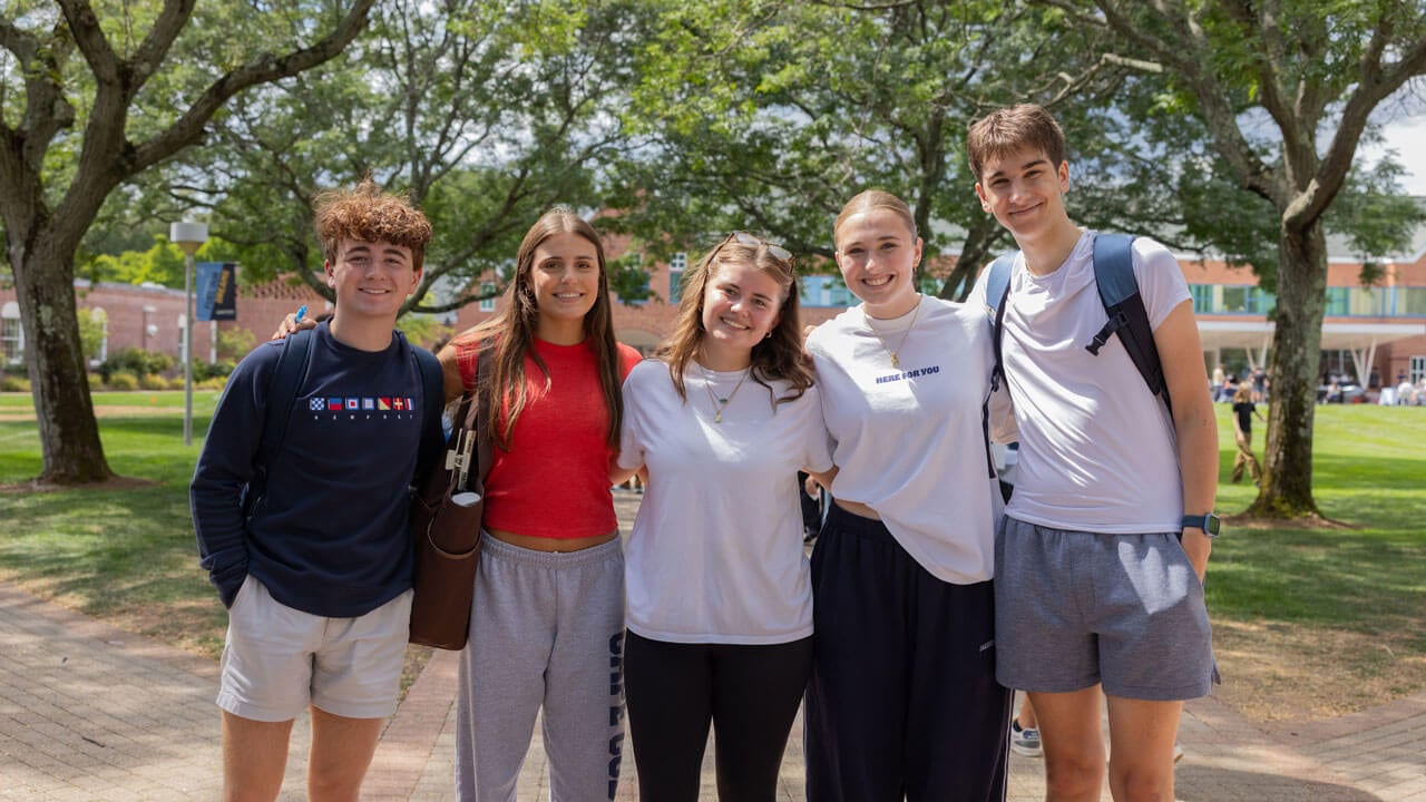 A group of student smile for a photo