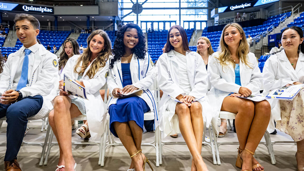 Nurses sitting down in the M&T Bank Arena for the 2025 pinning ceremony