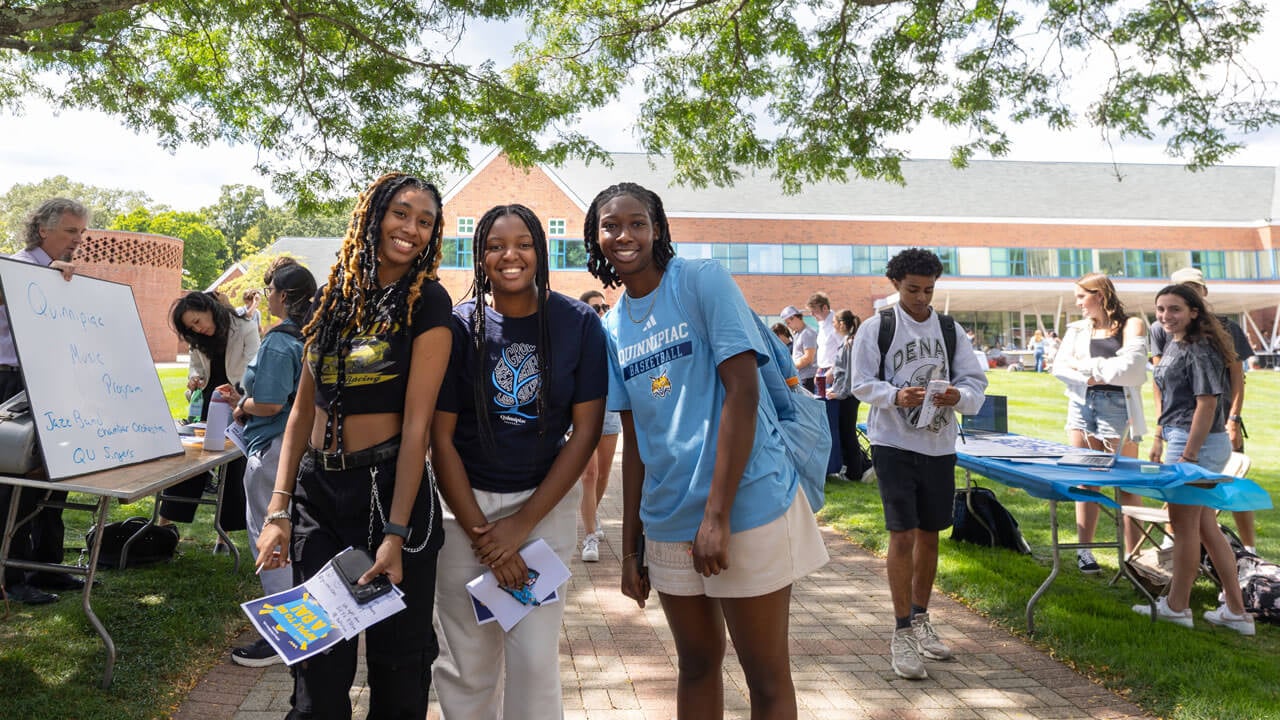 Students pose for their picture on the quad