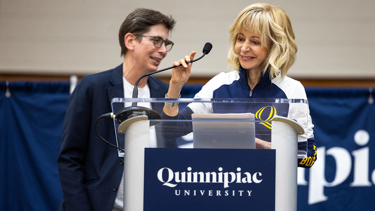 President Judy Olian and Provost Debra Liebowitz laugh on stage