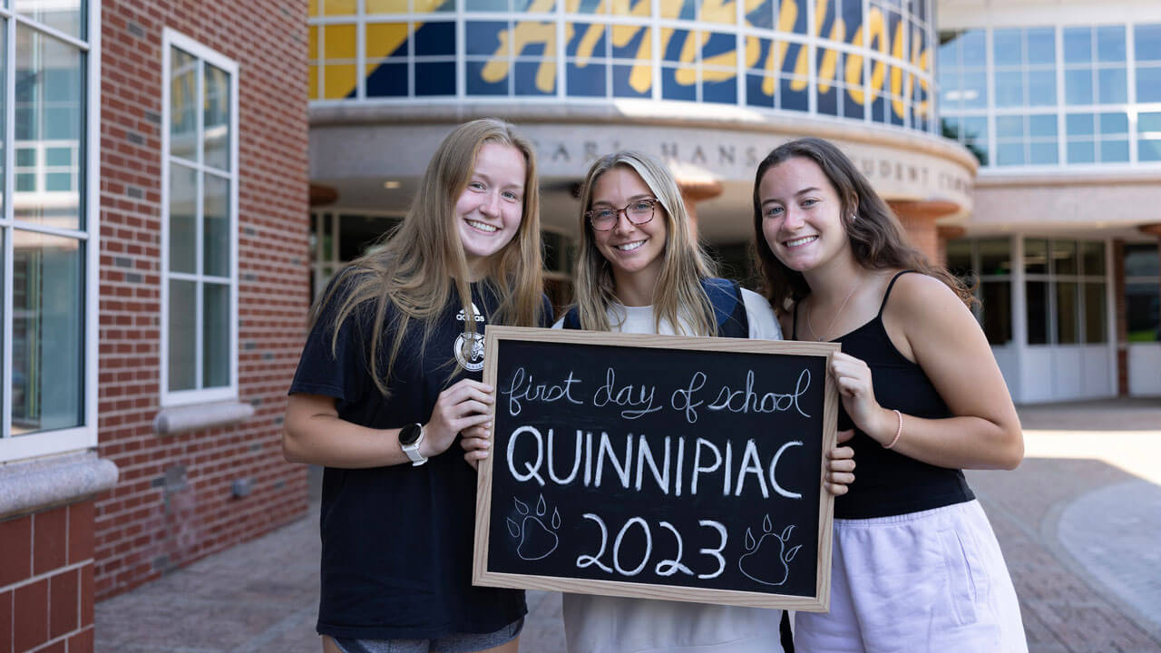 Three students take a photo on the first day of school