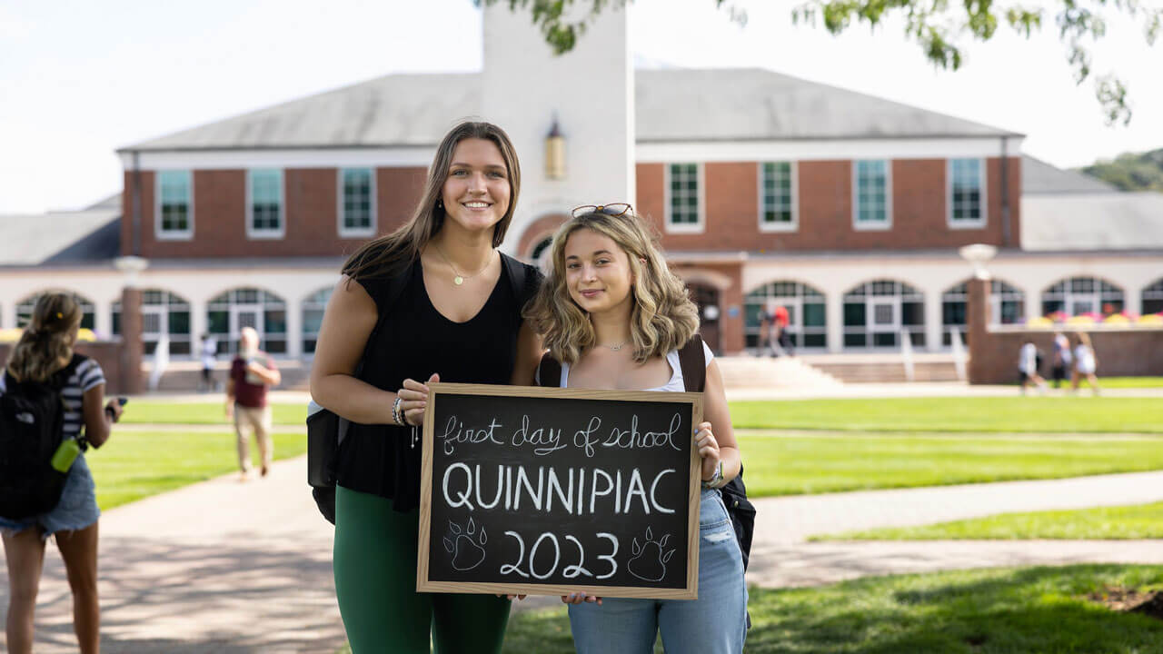 Students pose for a photo on the quad