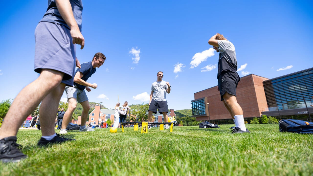 Students playing Spikeball on the South Quad