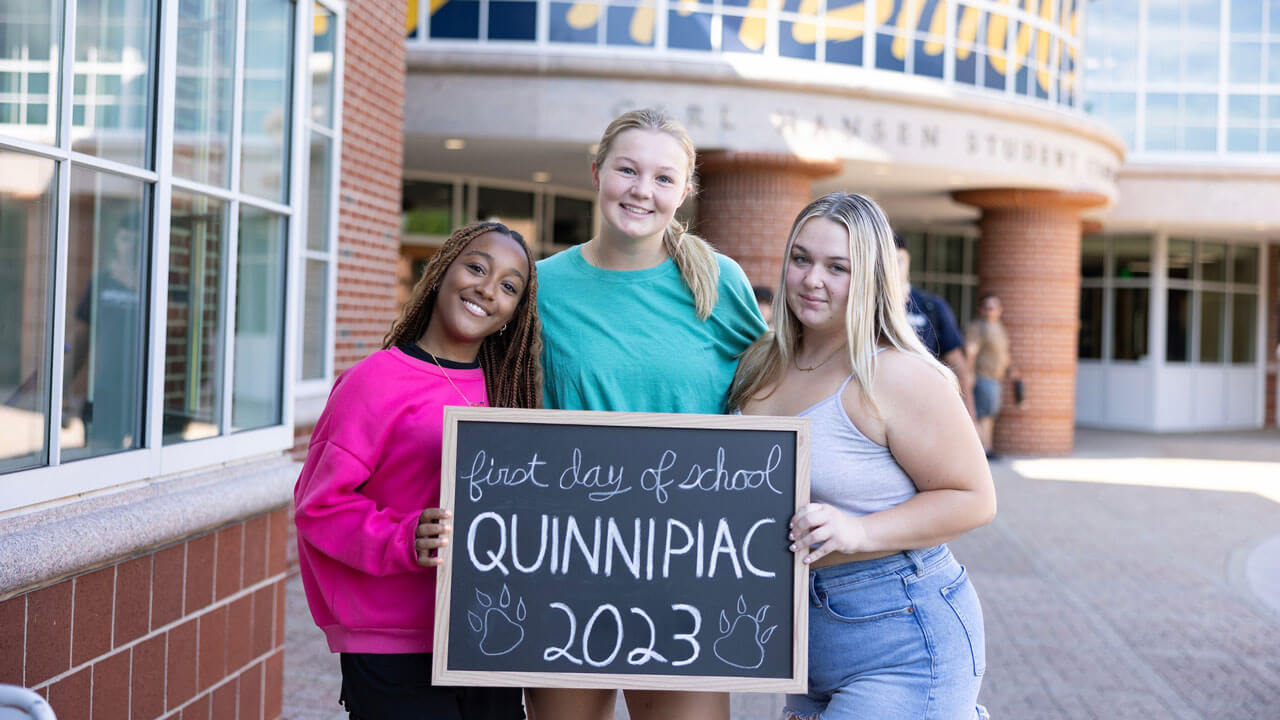 Students smile for the camera on the first day of classes