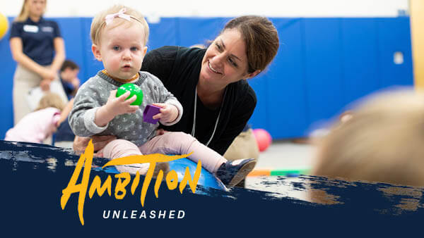 Valerie Strange works with a small child for occupational therapy.