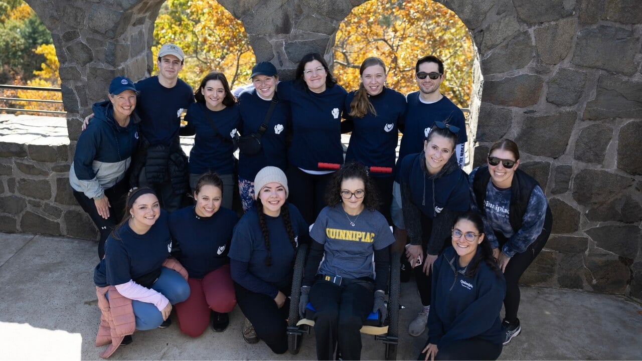 A group of students a part of the All Abilities team taking a photo at sleeping giant.