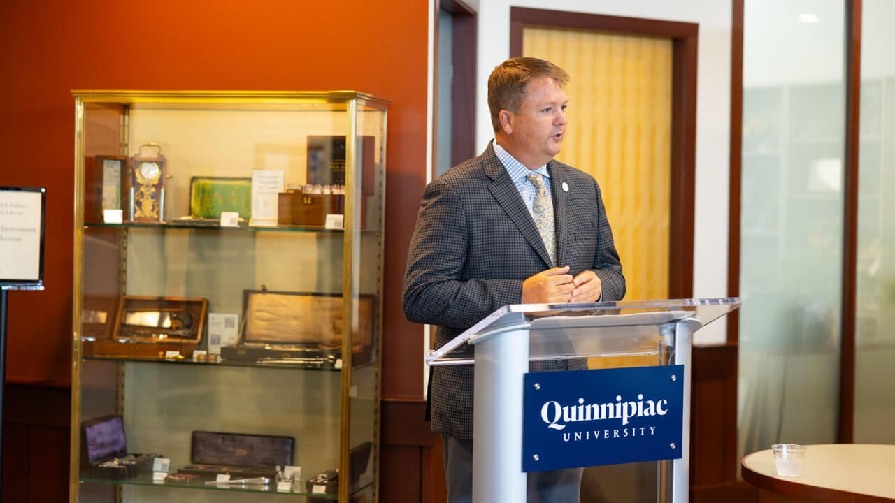 Speaker presents at podium