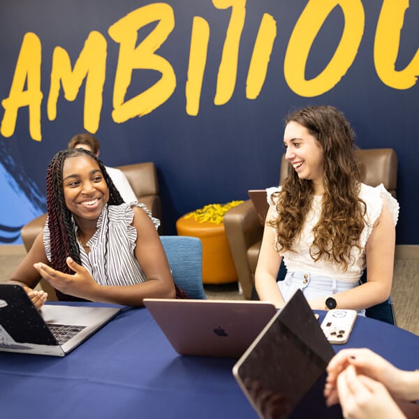 Three students collaborating in the Career and Experiential Learning Lab.