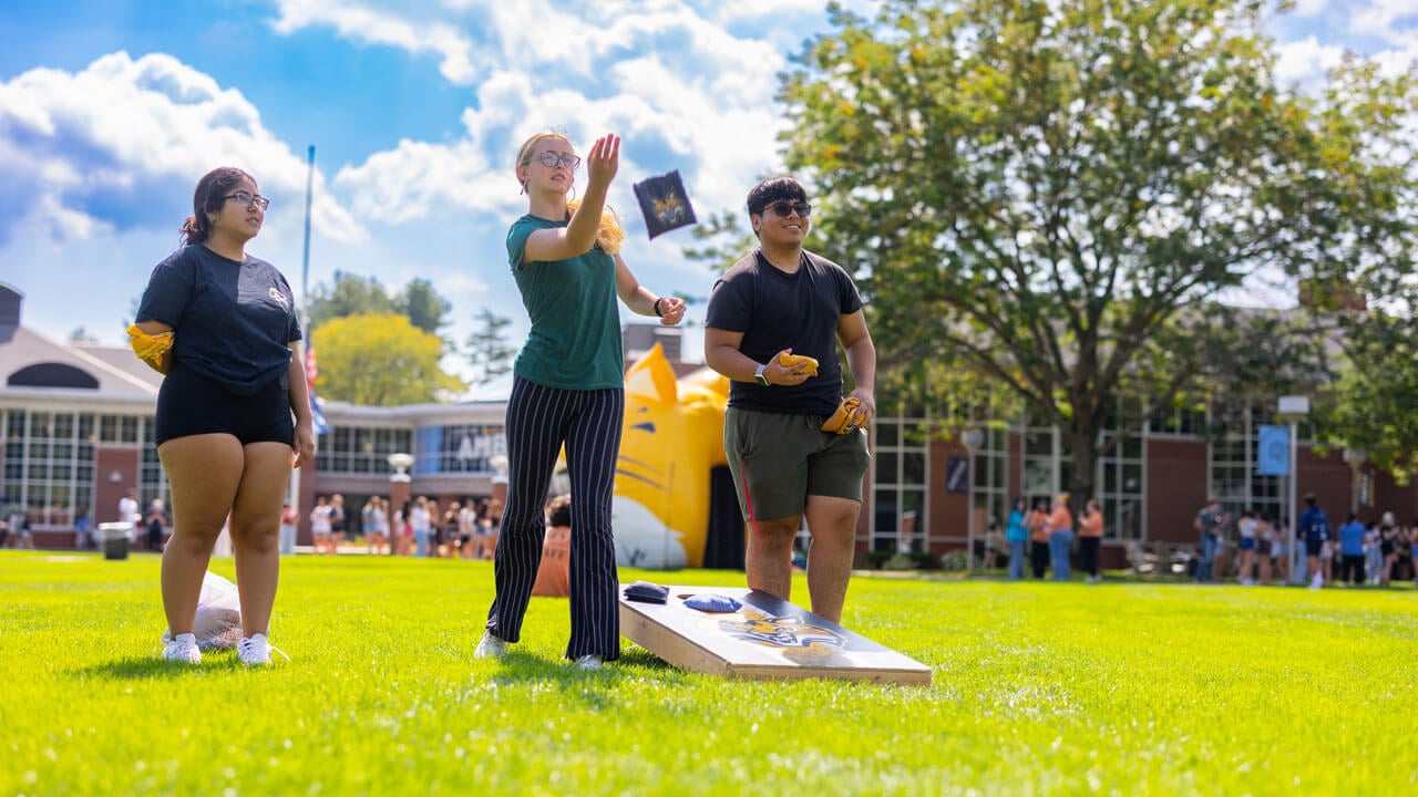 students hang out on the quad during fall fest