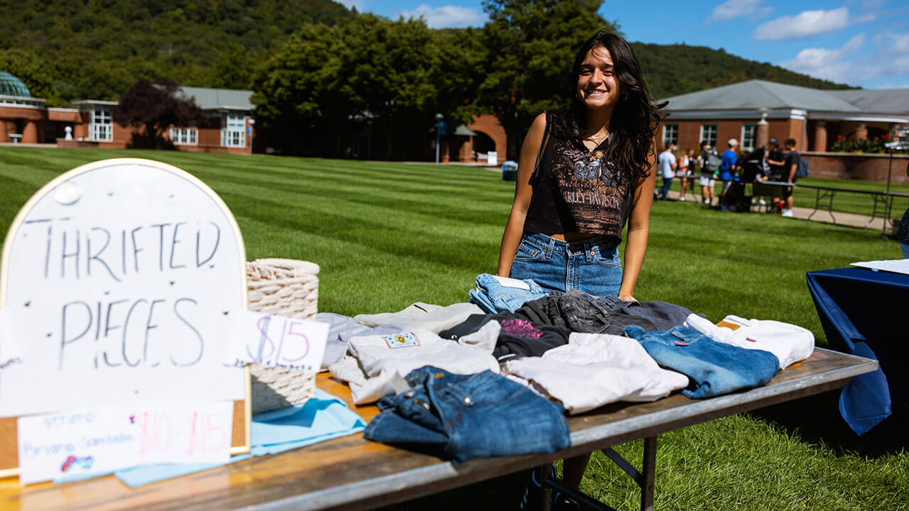 Briana Sambolin on the Quad with her thrift store pop-up-shop