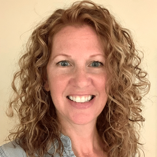 Diane Langlan-Wortz smiling against a beige background