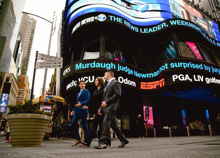 Business students walk through Times Square during the 2023 GAME Forum Financial Conference.