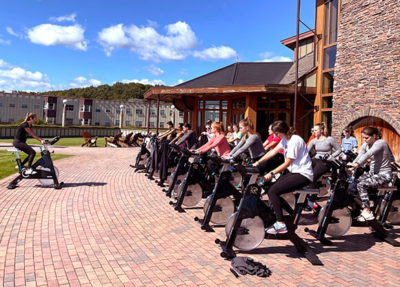 Students participate in a spin class outside the Rocky Top Student Center.