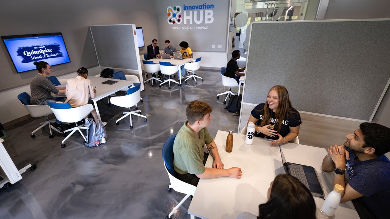 Business students collaborating in the School of Business Innovation Hub.