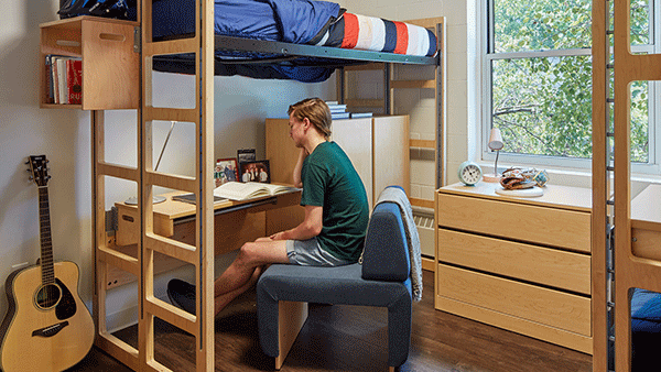 Freshman sitting in his dorm