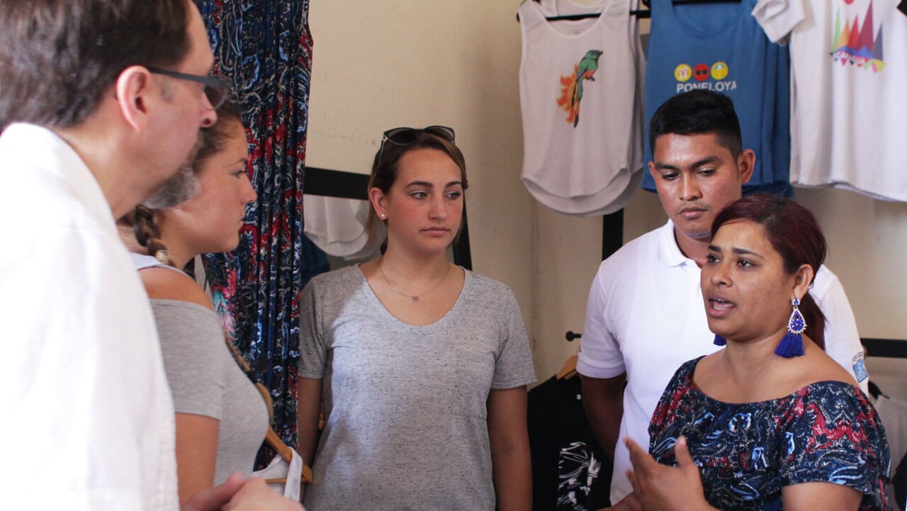Business students meet with a business owner in Leon, Nicaragua