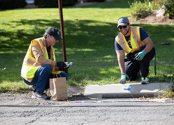 Engineering students install drain medallions in the local Hamden community